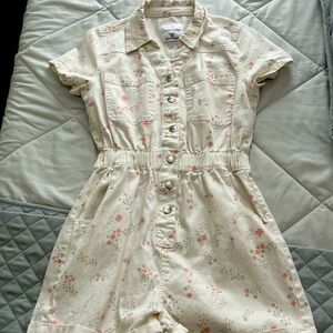 White romper with green and pink flowers